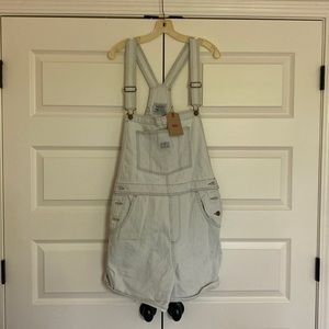 Never been worn with tags on pinstripe white background with light blue stripes.